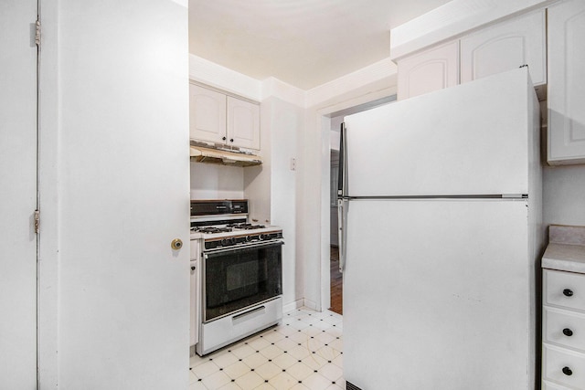 1137 Merrifield St SE, Grand Rapids, MI 49507 - kitchen featuring white appliances, under cabinet range hood, white cabinetry, light flooring, and light countertops