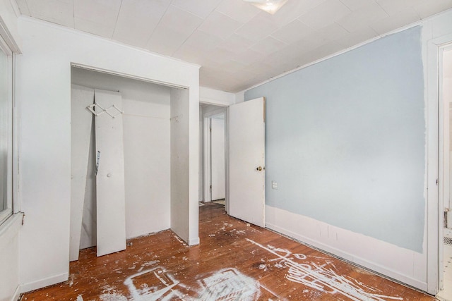 1137 Merrifield St SE, Grand Rapids, MI 49507 - unfurnished bedroom with a closet, ornamental molding, and wood finished floors