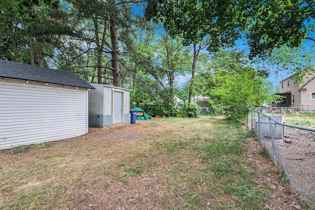 1137 Merrifield St SE, Grand Rapids, MI 49507 - fenced backyard with a storage unit