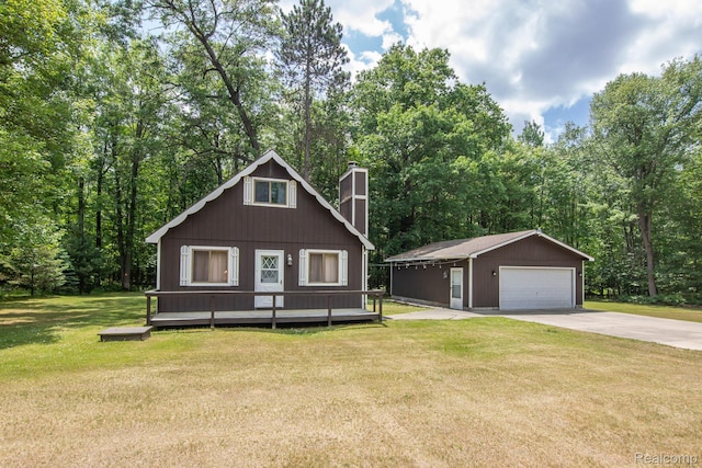 202 Redwine Dr, Houghton Lake, MI 48629 - view of front of home featuring a chimney, an outbuilding, a detached garage, and a front yard