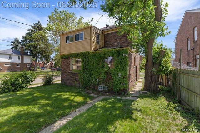 17617 Indiana St, Detroit, MI 48221 - back of house featuring brick siding