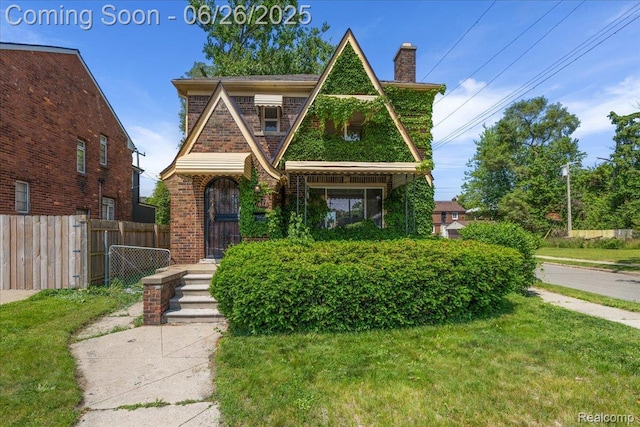 17617 Indiana St, Detroit, MI 48221 - tudor home featuring a chimney and brick siding