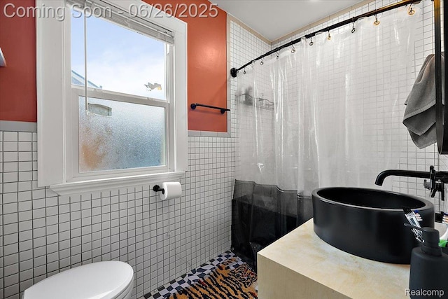17617 Indiana St, Detroit, MI 48221 - bathroom featuring tile walls, a tile shower, and wainscoting