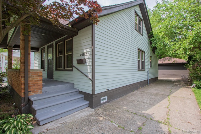 24917 Dale Ave, Eastpointe, MI 48021 - view of side of home featuring crawl space and a porch