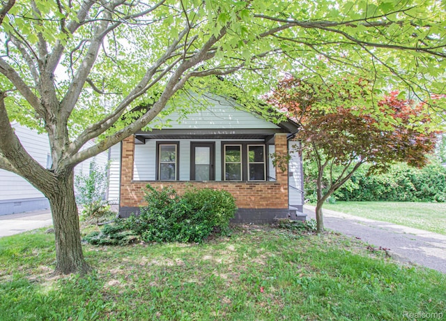 24917 Dale Ave, Eastpointe, MI 48021 - view of front facade featuring brick siding and a front lawn