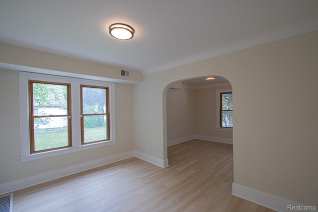 24917 Dale Ave, Eastpointe, MI 48021 - unfurnished room featuring arched walkways and light wood-style flooring