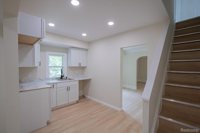 24917 Dale Ave, Eastpointe, MI 48021 - kitchen with white cabinetry, light wood finished floors, light countertops, and recessed lighting