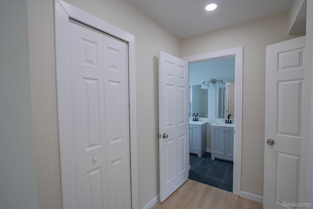 24917 Dale Ave, Eastpointe, MI 48021 - hallway featuring wood finished floors and a sink