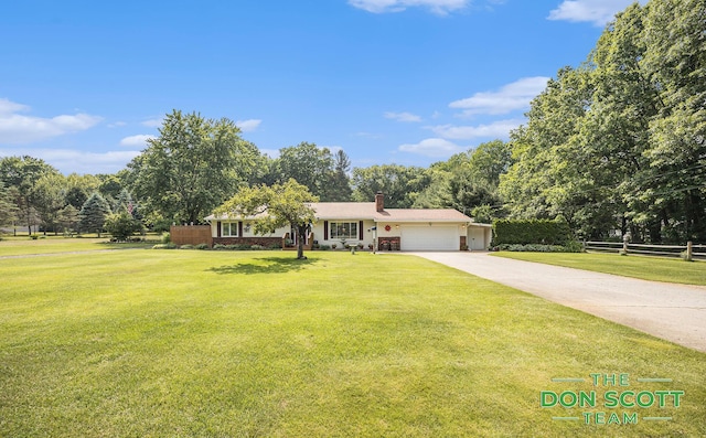 11829 Hoskins Ave NE, Cedar Springs, MI 49319 - ranch-style house with an attached garage, a chimney, concrete driveway, and view of scattered trees