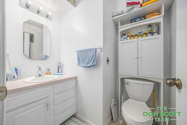 11829 Hoskins Ave NE, Cedar Springs, MI 49319 - bathroom with vanity and toilet