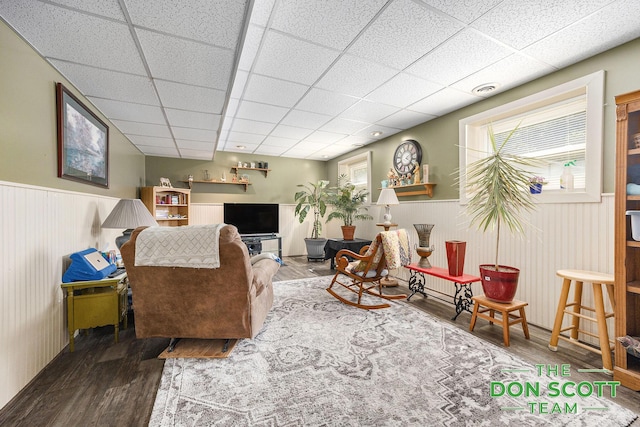 11829 Hoskins Ave NE, Cedar Springs, MI 49319 - living area featuring wood finished floors, wainscoting, and a drop ceiling