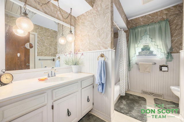 11829 Hoskins Ave NE, Cedar Springs, MI 49319 - bathroom featuring vanity, wallpapered walls, and shower / bath combo with shower curtain