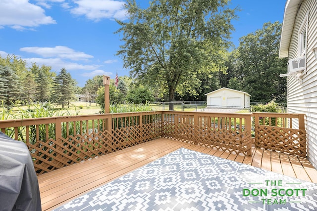 11829 Hoskins Ave NE, Cedar Springs, MI 49319 - deck with a garage, an outbuilding, view of wooded area, and cooling unit