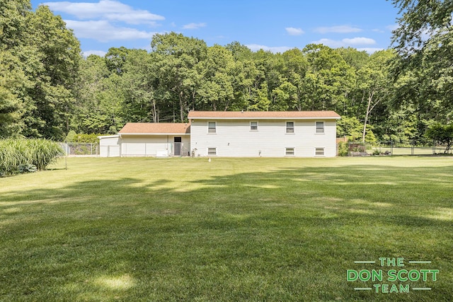 11829 Hoskins Ave NE, Cedar Springs, MI 49319 - rear view of property featuring a wooded view