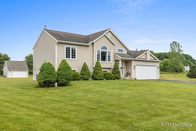 4233 Ives Farm Ln NE, Cedar Springs, MI 49319 - tri-level home with a front lawn, an attached garage, driveway, and a shingled roof
