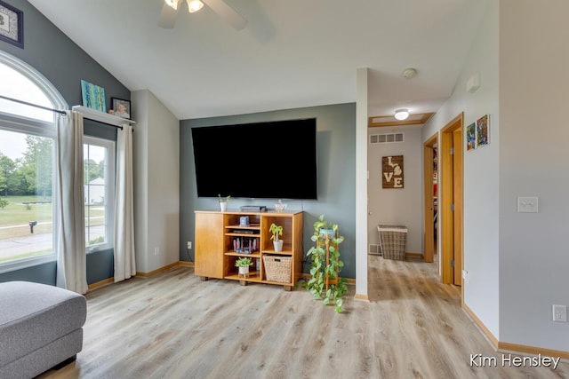 4233 Ives Farm Ln NE, Cedar Springs, MI 49319 - living area with light wood-style floors, a ceiling fan, and vaulted ceiling