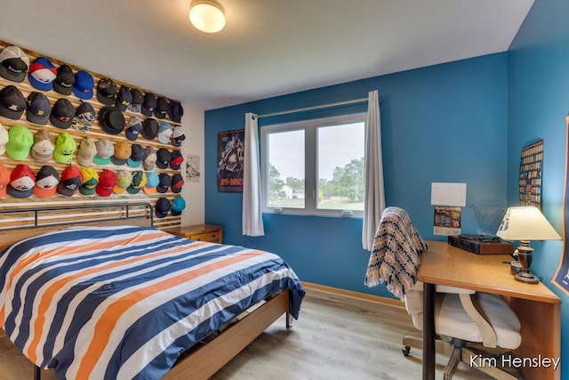 4233 Ives Farm Ln NE, Cedar Springs, MI 49319 - bedroom with wood finished floors and baseboards