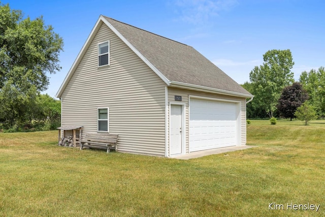 4233 Ives Farm Ln NE, Cedar Springs, MI 49319 - view of home's exterior featuring a garage, a shingled roof, and a yard