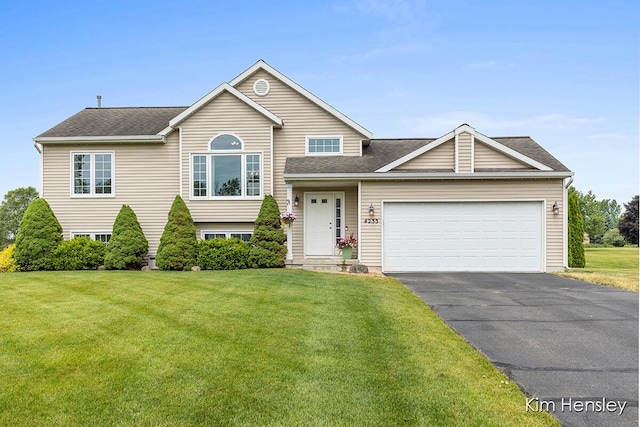 4233 Ives Farm Ln NE, Cedar Springs, MI 49319 - split level home with driveway, a front lawn, and a garage