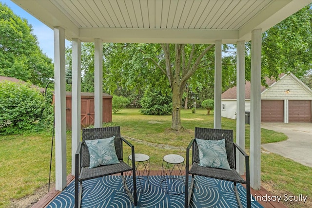 3976 Port Sheldon St, Hudsonville, MI 49426 - view of patio with an outbuilding, view of scattered trees, and a detached garage