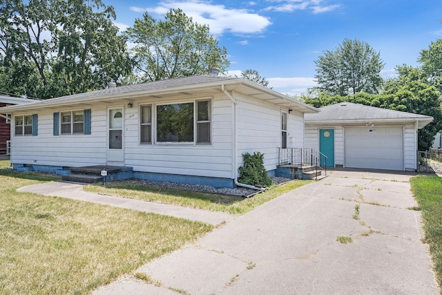 1975 Southwood Ave, Norton Shores, MI 49441 - ranch-style home with an outbuilding, concrete driveway, a front lawn, a garage, and a chimney