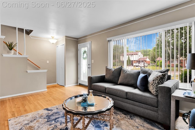 8798 Lozen Dr, Sterling Heights, MI 48313 - living room featuring wood finished floors and stairway