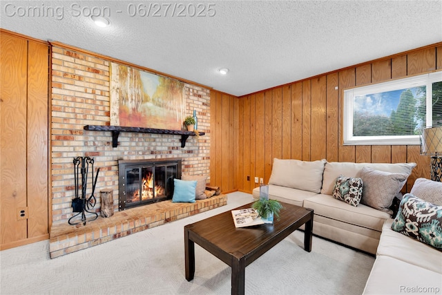 8798 Lozen Dr, Sterling Heights, MI 48313 - living area featuring wooden walls, a fireplace, carpet, and a textured ceiling
