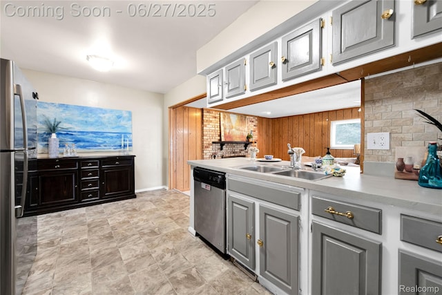 8798 Lozen Dr, Sterling Heights, MI 48313 - kitchen featuring appliances with stainless steel finishes, wooden walls, light countertops, and gray cabinets