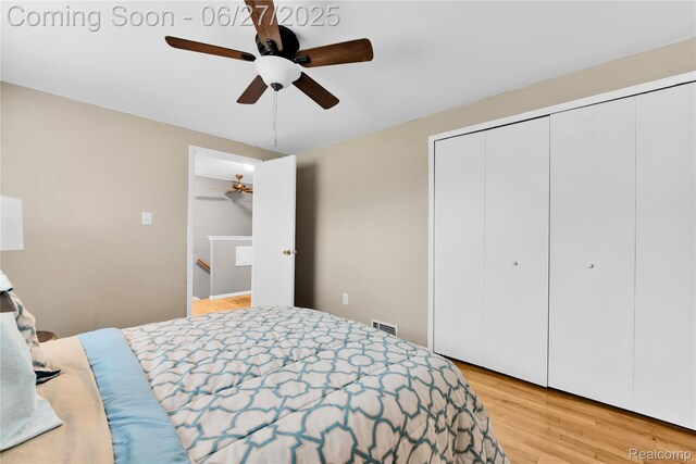 8798 Lozen Dr, Sterling Heights, MI 48313 - bedroom with light wood-style floors, a closet, and ceiling fan