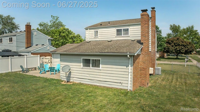 8798 Lozen Dr, Sterling Heights, MI 48313 - back of house with a patio, a chimney, and a shingled roof