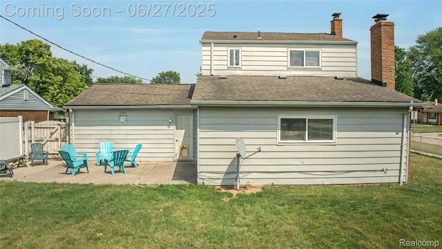 8798 Lozen Dr, Sterling Heights, MI 48313 - back of property with a patio area, a chimney, and a shingled roof