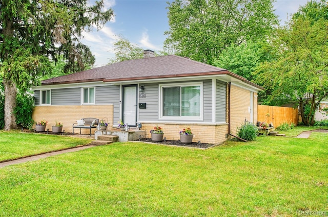 1478 Desoto Ave, Ypsilanti, MI 48198 - view of front of property featuring brick siding, a chimney, and a shingled roof