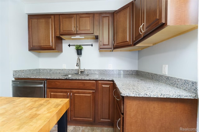 1478 Desoto Ave, Ypsilanti, MI 48198 - kitchen with dishwasher, wood counters, and brown cabinetry