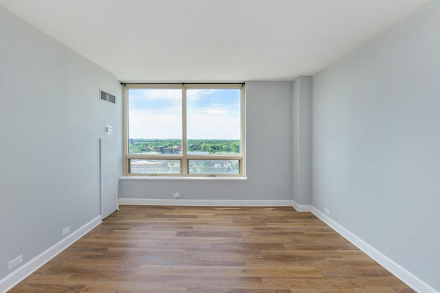 3320 Spinnaker Ln Unit 16D, Detroit, MI 48207 - empty room featuring wood finished floors and baseboards