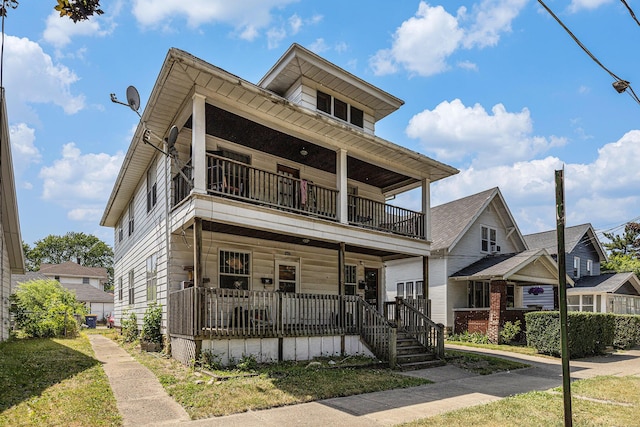 941 Mcreynolds Ave NW, Grand Rapids, MI 49504 - townhome / multi-family property featuring a balcony and covered porch