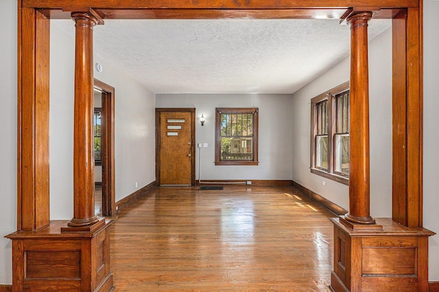941 Mcreynolds Ave NW, Grand Rapids, MI 49504 - foyer entrance featuring wood finished floors and a textured ceiling
