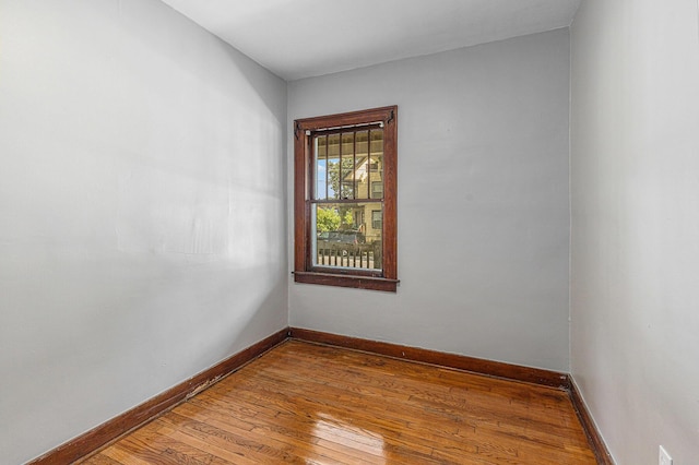 941 Mcreynolds Ave NW, Grand Rapids, MI 49504 - spare room with wood-type flooring and baseboards