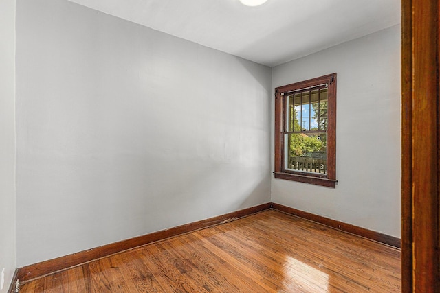 941 Mcreynolds Ave NW, Grand Rapids, MI 49504 - spare room with baseboards and wood finished floors