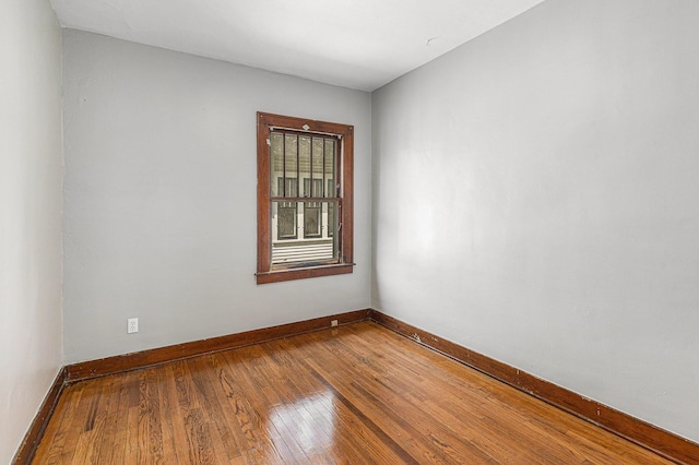 941 Mcreynolds Ave NW, Grand Rapids, MI 49504 - spare room featuring hardwood / wood-style floors and baseboards