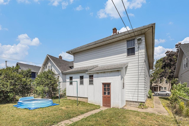 941 Mcreynolds Ave NW, Grand Rapids, MI 49504 - rear view of property featuring a chimney