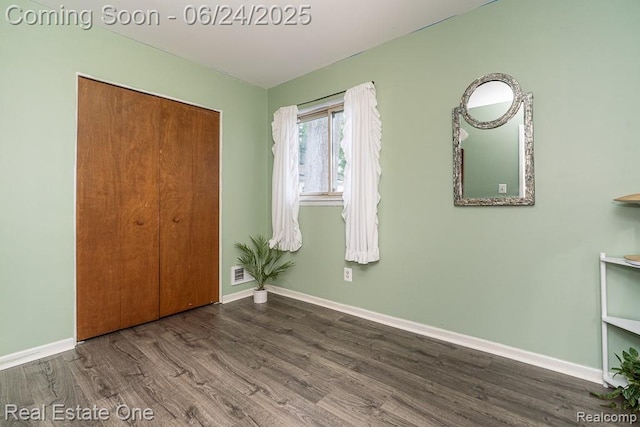 25893 Firwood Ave, Warren, MI 48089 - unfurnished bedroom with wood finished floors and a closet