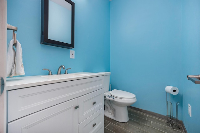 1156 N Bridge St, Linden, MI 48451 - half bathroom featuring vanity and wood finish floors