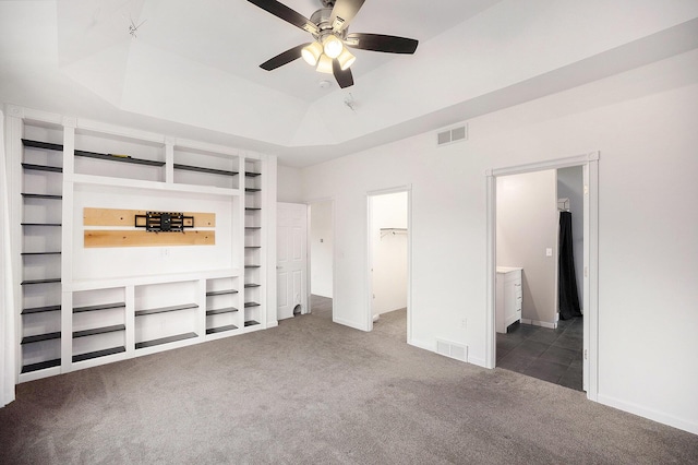 1156 N Bridge St, Linden, MI 48451 - unfurnished bedroom with carpet flooring, a walk in closet, a raised ceiling, ensuite bath, and a closet