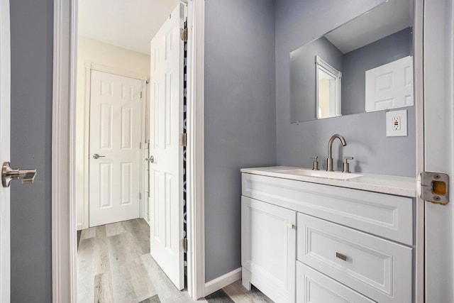 1156 N Bridge St, Linden, MI 48451 - bathroom with wood finished floors and vanity