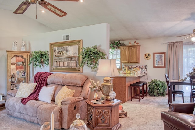 845 Riverlane Dr, Owosso, MI 48867 - carpeted living area featuring a ceiling fan and vaulted ceiling