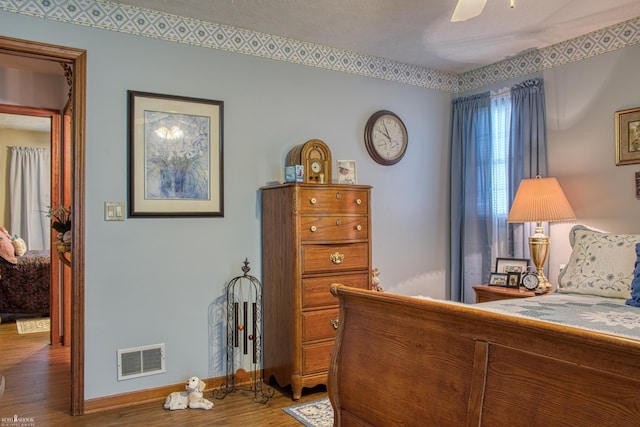 845 Riverlane Dr, Owosso, MI 48867 - bedroom with wood finished floors and a ceiling fan