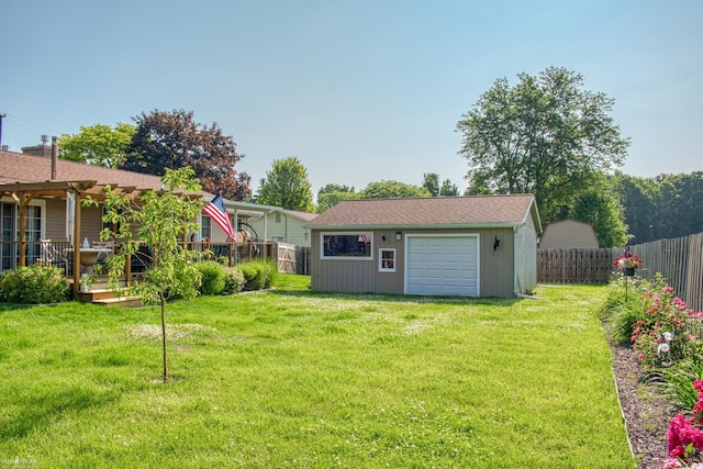 845 Riverlane Dr, Owosso, MI 48867 - fenced backyard with an outbuilding and a detached garage