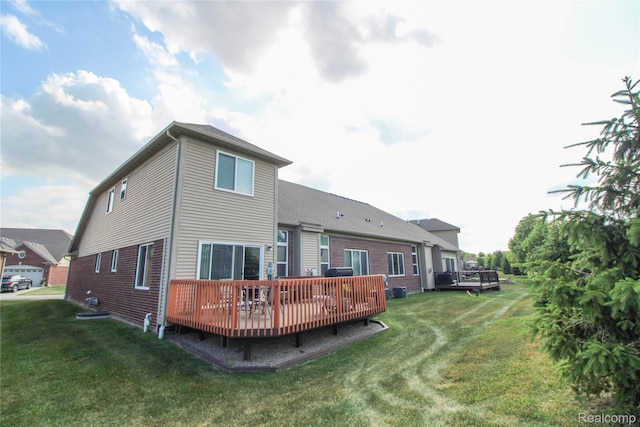 30475 Berghway Trl, Warren, MI 48092 - back of property with a lawn, a deck, and brick siding