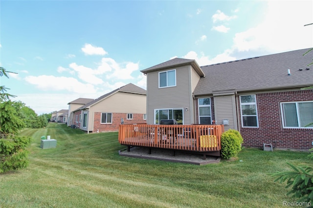 30475 Berghway Trl, Warren, MI 48092 - back of property featuring a wooden deck, a lawn, brick siding, and roof with shingles