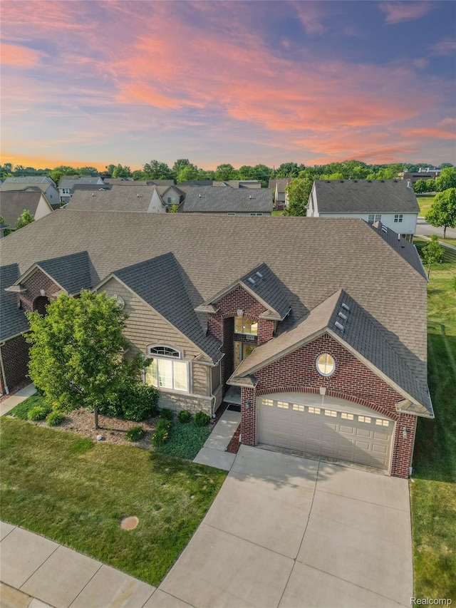 30475 Berghway Trl, Warren, MI 48092 - traditional home with concrete driveway, an attached garage, a shingled roof, brick siding, and a yard